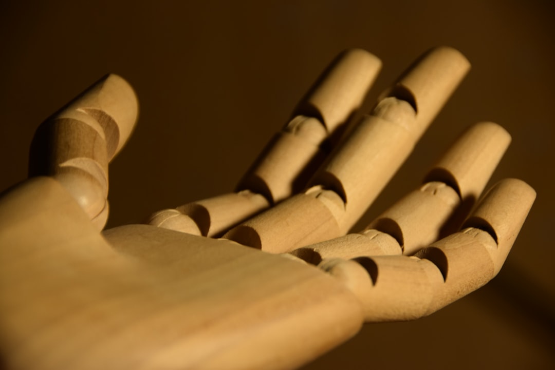 Several hands clasped together, symbolizing support and community.